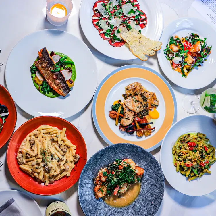 A selection of menu items laid out on the table at Tutto, one of the best Italian restaurants in Vancouver.