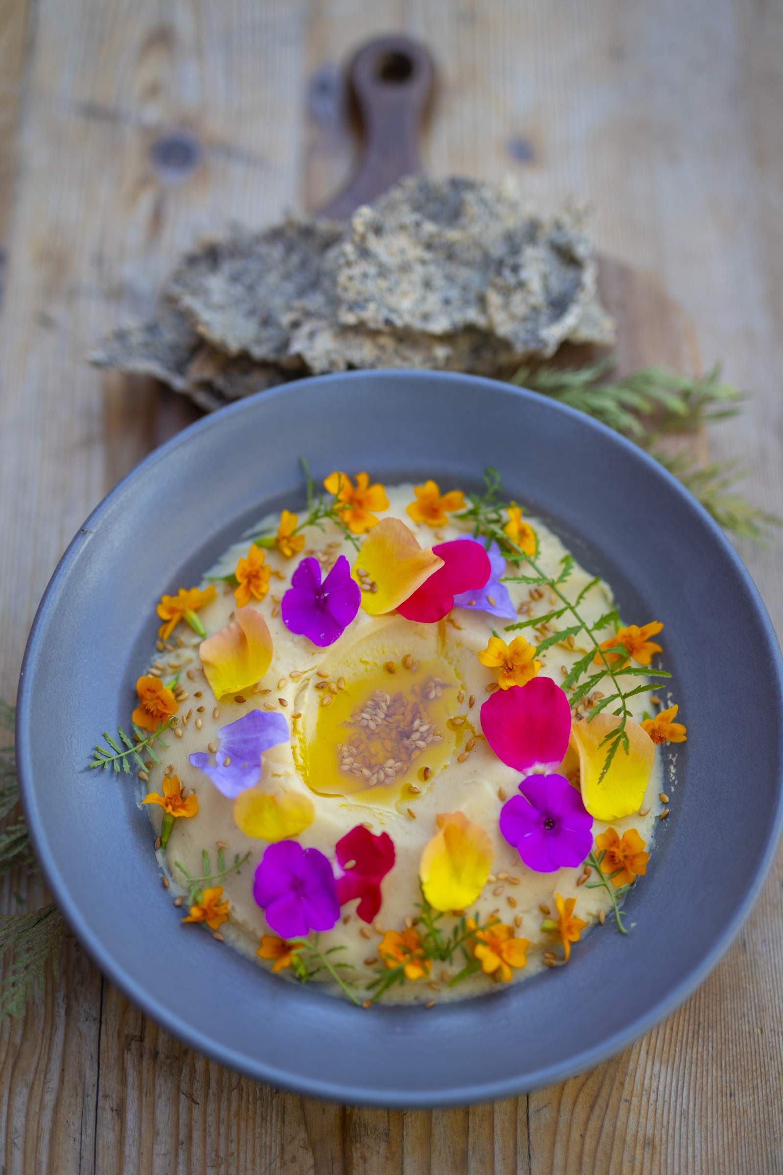 A dish served at River Café in Calgary garnished with edible flowers