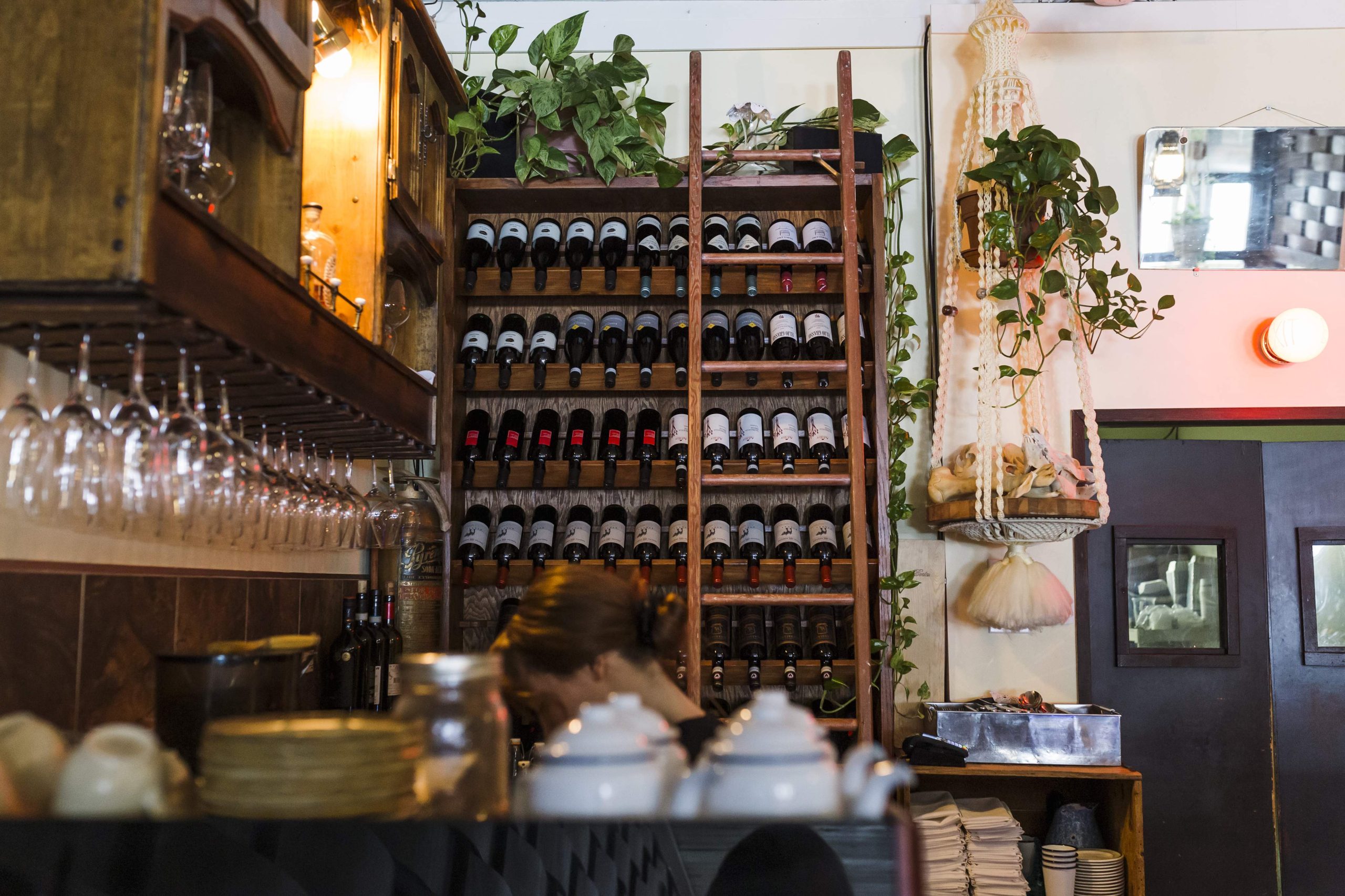 The interior of Primal restaurant in Saskatoon, featuring a wine display shelf