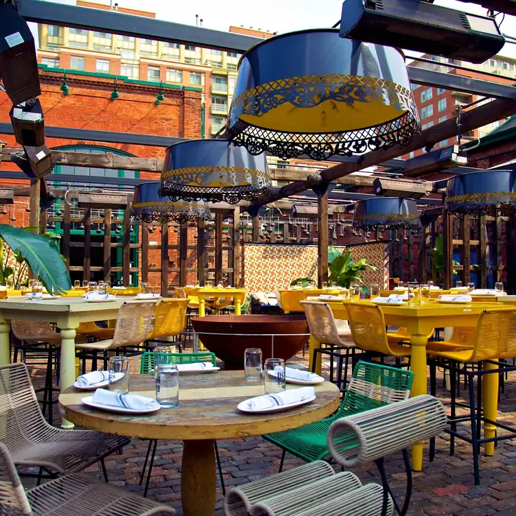 A colorful outdoor terrace with Mexican-inspired decor at El Catrin, one of the best Mexican restaurants in Toronto