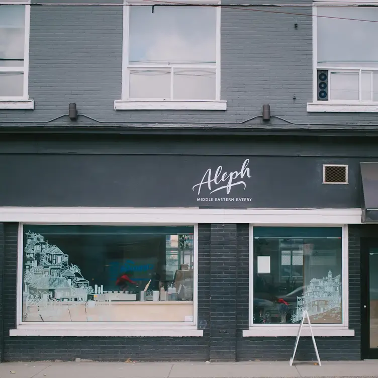 The grey facade with large windows at Aleph Middle Eastern Eatery, one of the best brunch spots in Vancouver