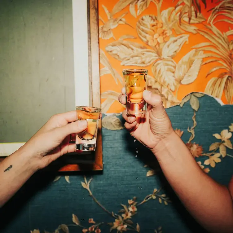 Two people cheering with shots at The Lamplighter Public House