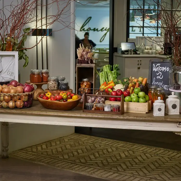 A display of fruit baskets, vegetables and jams at Honey Salt