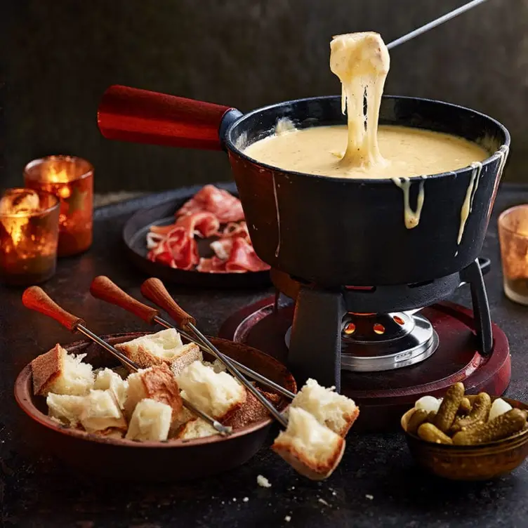 A cheese fondue at The Living Room Restaurant, one of the best cozy and warm restaurants in Canada