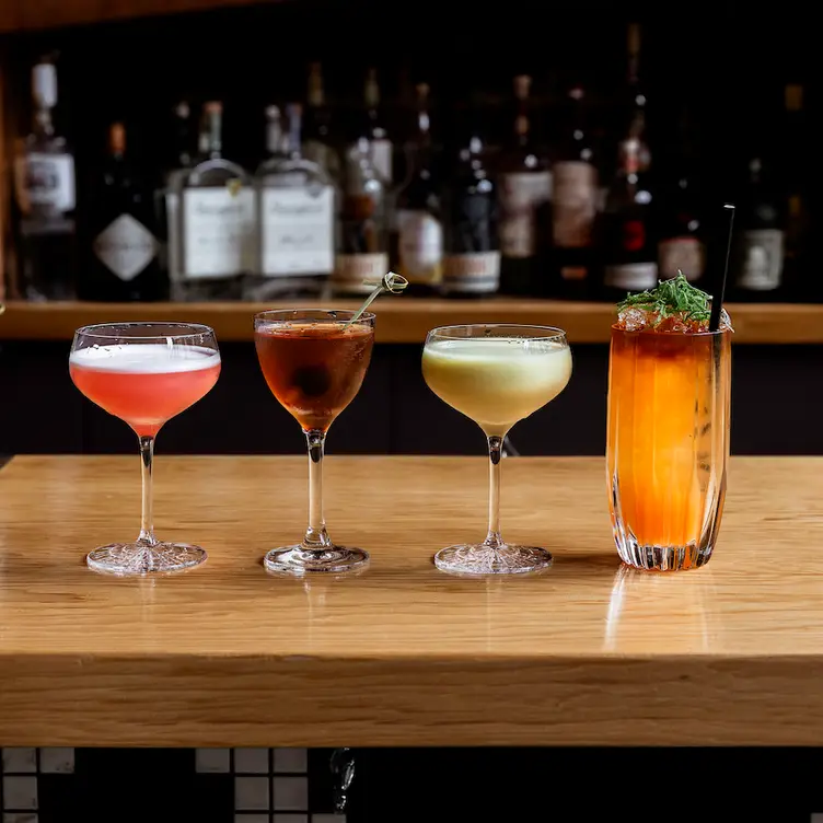 An array of different alcoholic cocktails at L’Abattoir Restaurant, one of the best special occasions restaurants in Vancouver.