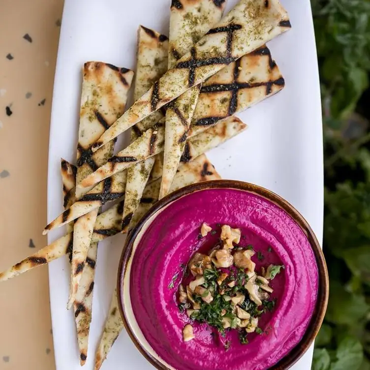 The colourful dips are the perfect shareable for your table at Nuba, one of the best vegetarian-friendly restaurants in Vancouver.