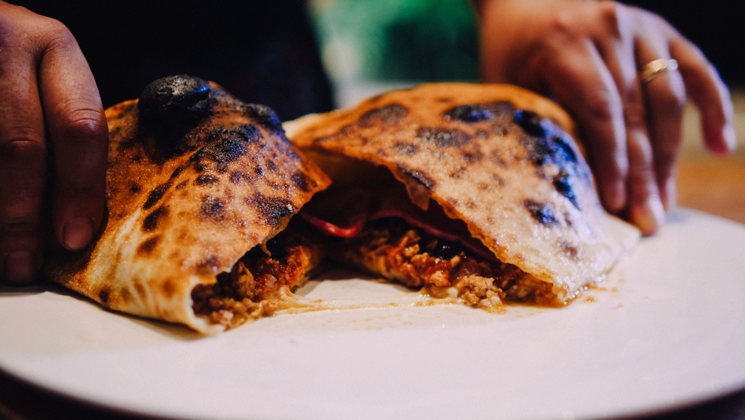 Wood fired calzone pizza at Cibo Wine Bar King