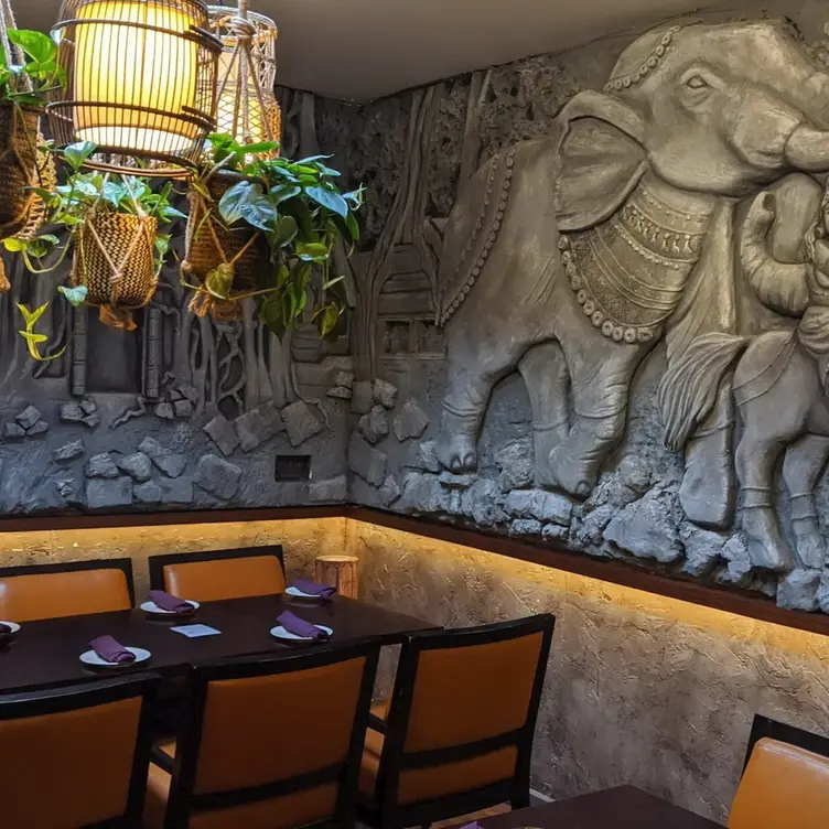 The dining room area at Sula Indian Restaurant, featuring classic cultural interior decor.