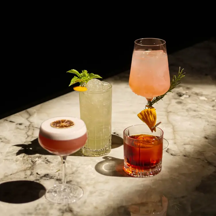 Colorful cocktails on a bar at DaNico, one of the best Toronto Italian restaurants.