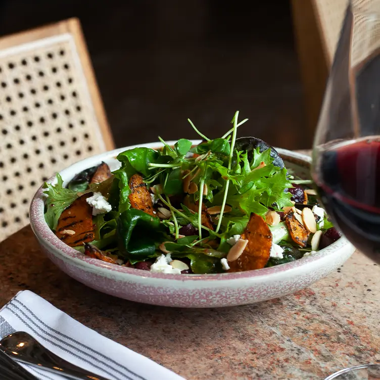 A golden beet salad with arugula at Sorella, one of the best Italian restaurants in Calgary.