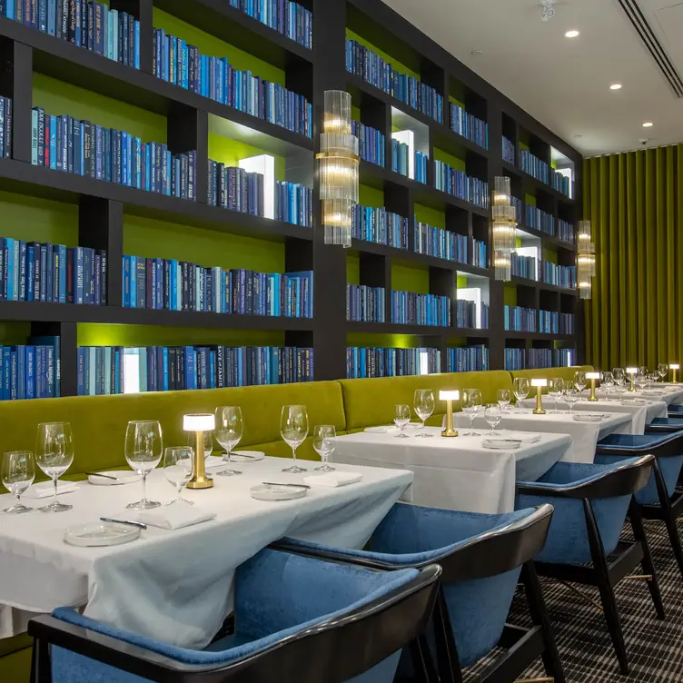 Books line the walls at Luca, possibly one of the best Italian restaurants in Calgary.