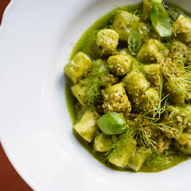 A gnocchi dish in green sauce at GIA Toronto, one of the best vegetarian restaurants in Toronto