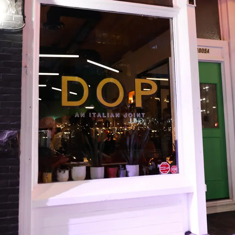 The exterior window of D.O.P. facing the street at D.O.P., one of the best Italian restaurants in Calgary.