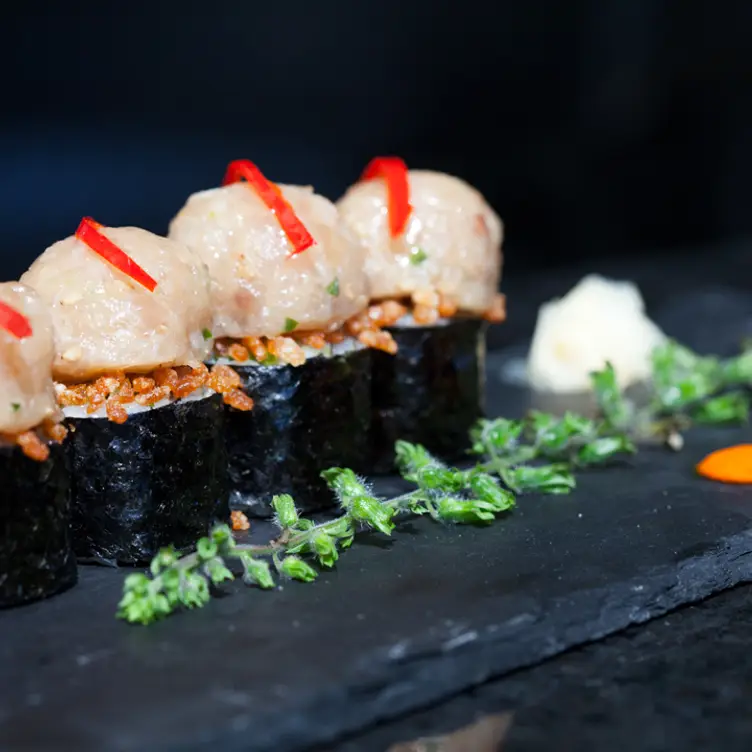 Fresh Hotate Hokkaido scallops sit on top of sushi at Ki Modern Japanese + Bar.