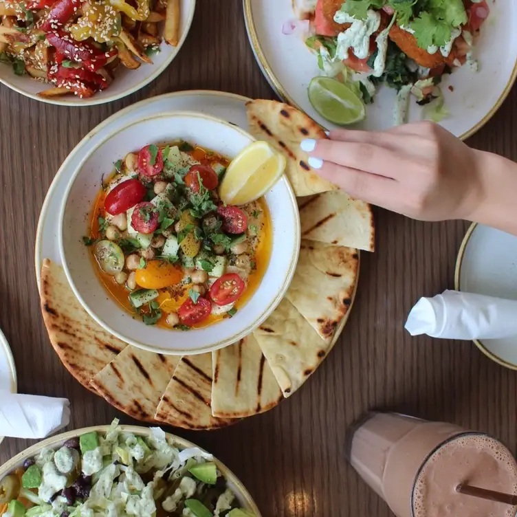 Hummus with parsley and grilled pita from Fresh Kitchen + Juice Bar.