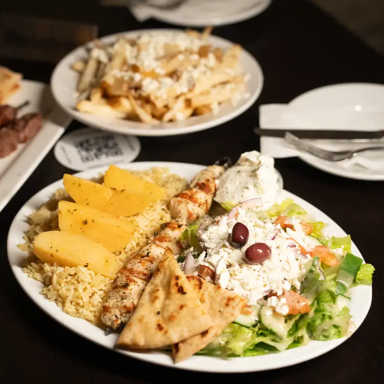 The chicken souvlaki plate with favorite sides at Classic Cafe & Lounge, one of the best Greek restaurants near Toronto.