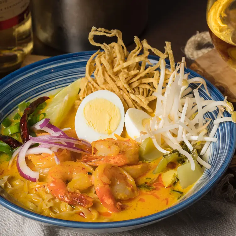 A golden curry with shrimp and noodles at ThairoomGrand, one of the best Thai restaurants in Toronto.