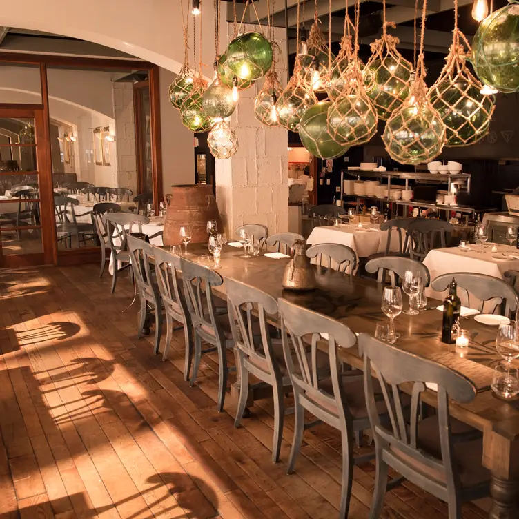 The dining room is elegant and open at Estiatorio VOLOS, one of the best restaurants in Greektown Toronto.