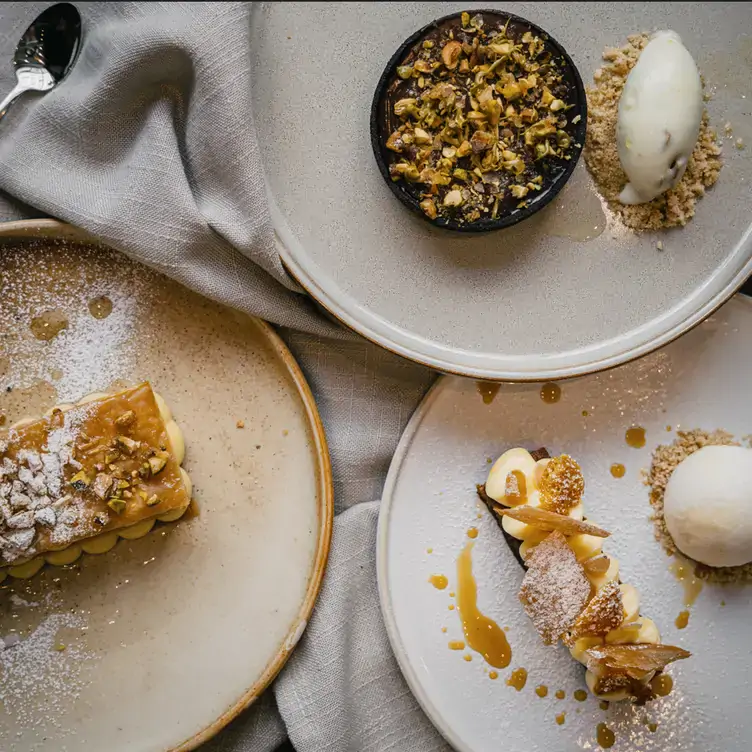 Three different desserts from the menu at Mama C, one of the best date restaurants in Montreal.