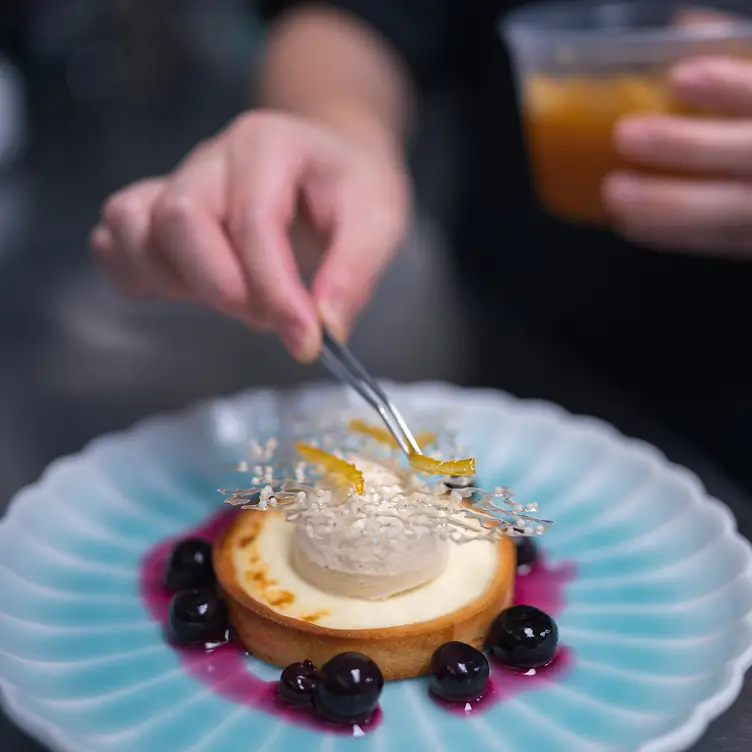 A Japanese cheese tart with grapes at Minami Restaurant, some of the top Japanese cuisine in Toronto.