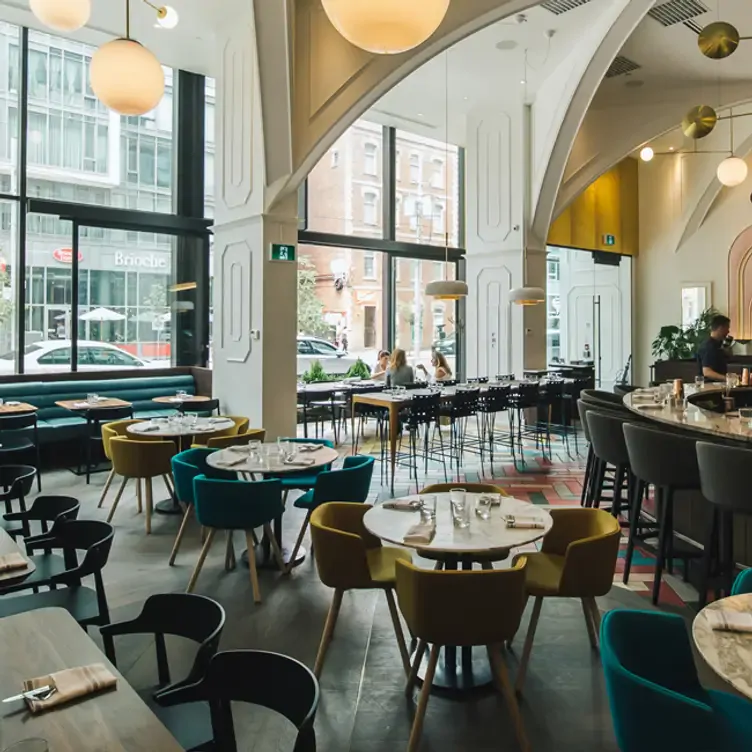 The sun-bathed dining room at Oretta, possibly the best Valentine’s restaurants Toronto offers.