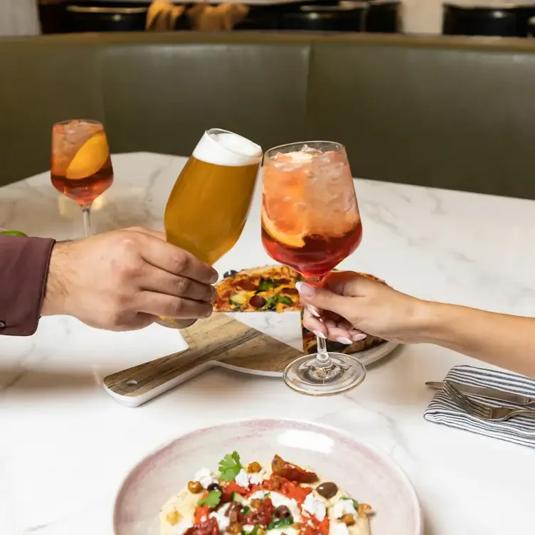 Celebrate Valentine’s Day with original cocktails, ice cold beer, and shareables like pizza and hummus at Taps Public House. Credit: Taps Public House