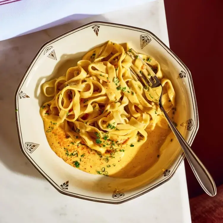 Creamy tagliatelle with seasonal ingredients at The Rosebud, one of the best new restaurants in Toronto 2024.