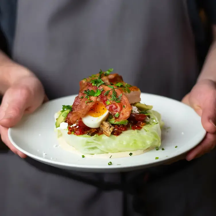 A bacon avocado cobb salad at Moxies, one of the best family restaurants Calgary offers.