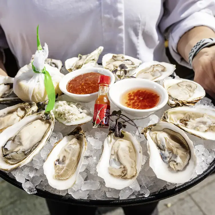 A spicy and citrusy bite of Petros82 fresh and hand-picked oysters at one the best seafood restaurants in Toronto.