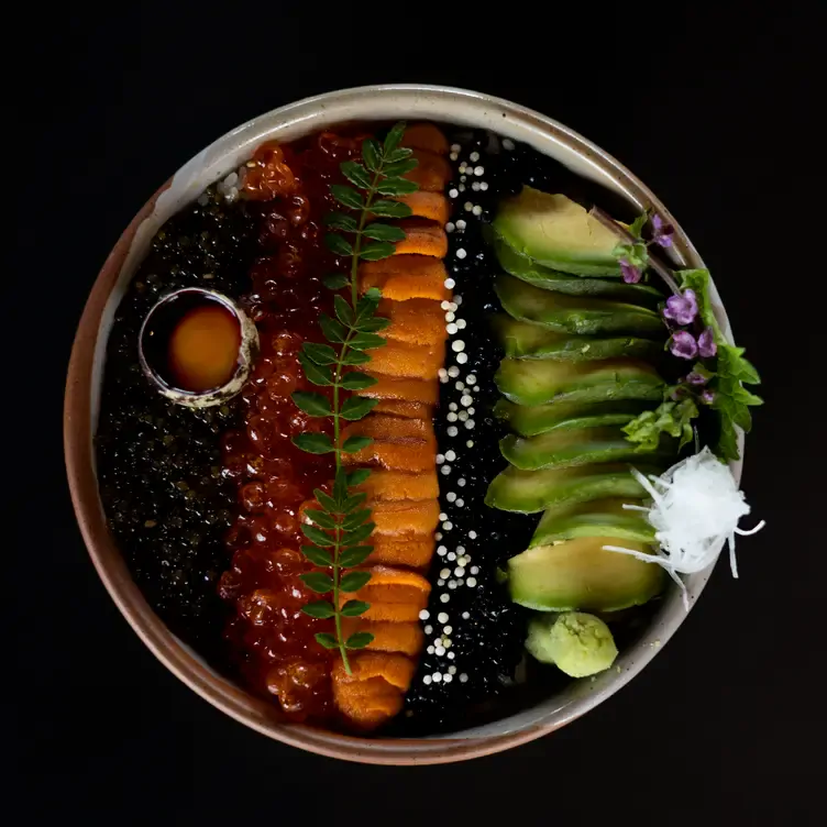 A bowl with avocado, mushrooms, and fish roe at AP, one of the best Valentine’s Day restaurants in Toronto.