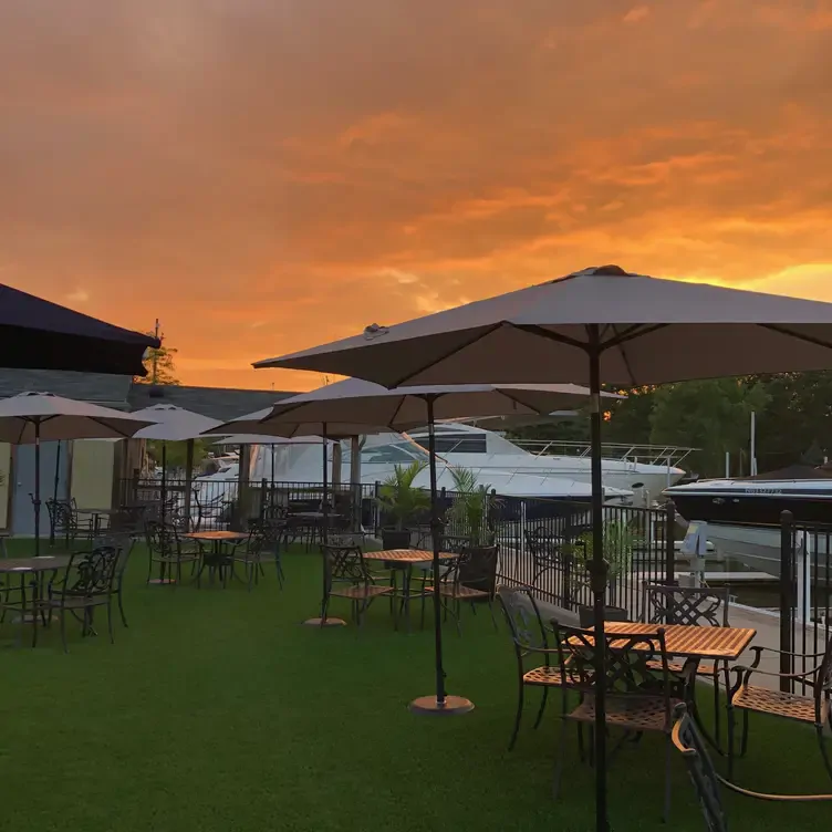 Sunset sets the mood over the patio at one of the best seafood restaurants in the Greater Toronto Area.