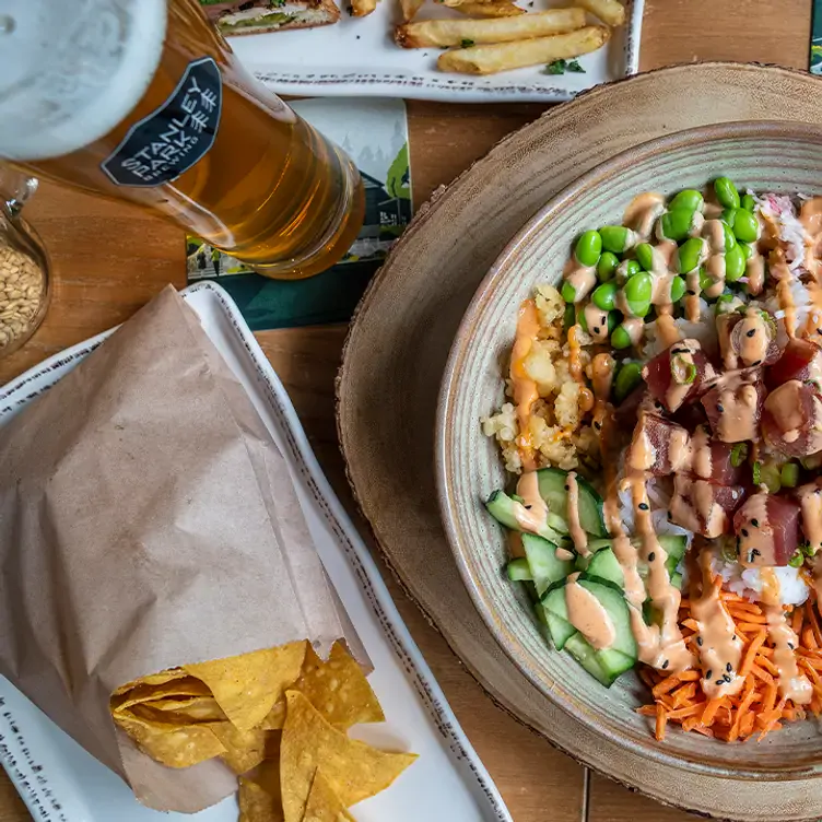 A plate of mixed vegetables with a side of nachos at Stanley Park Brewing Restaurant & Brewpub, one of the best family restaurants in Vancouver.