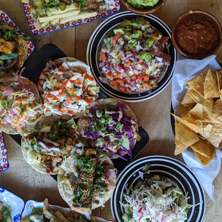 Fresh corn tostadas and salads at El Pocho Antojitos, one of the best Mexican restaurants in downtown Toronto.