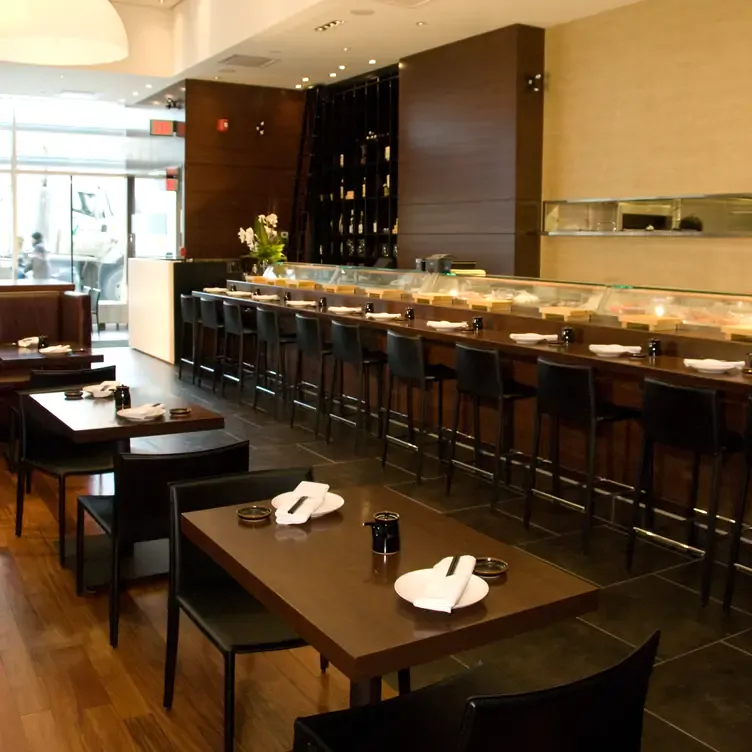 The sleek and modern dining room at Sukiyaki House, where diners can choose to sit at the bar to watch the chef work, or at a private table.