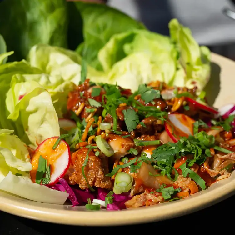 A close-up of a salad with meat at Bells & Whistles.