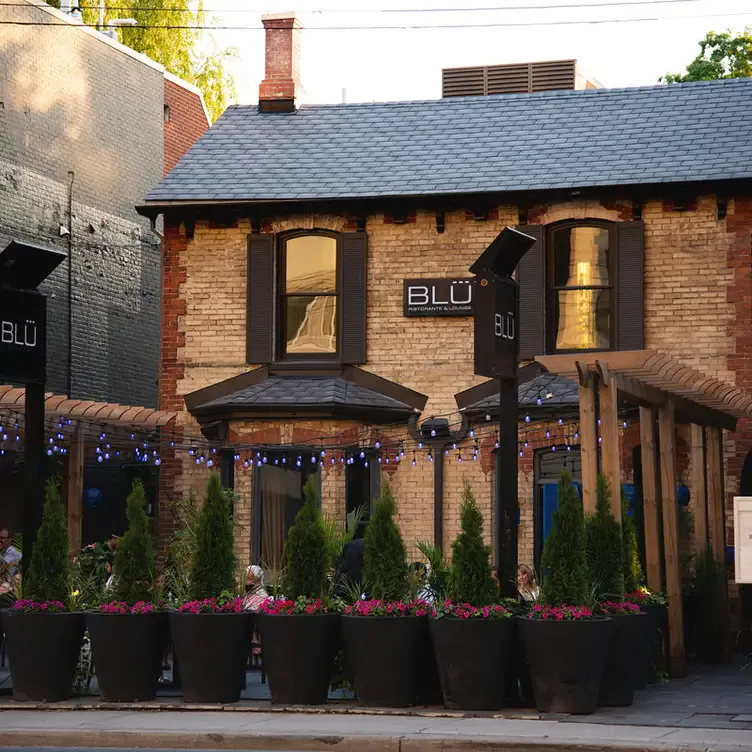 The brick exterior of BLU Ristorante, one of the best restaurants for Valentine’s Day in Toronto.