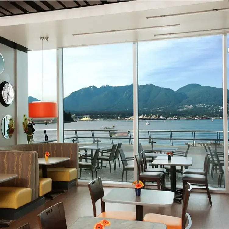 View of the outside patio and Vancouver Bay of De Dutch, one of the best family restaurants in Vancouver.