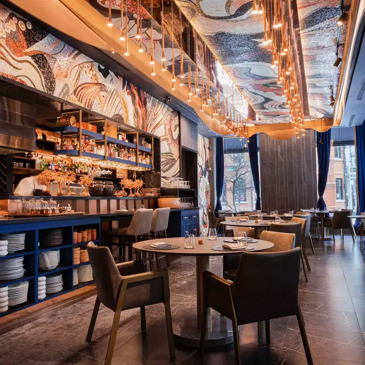 It only takes a moment for your eyes to be wowed by the artistic design that encompasses Enigma’s interior. Credit: Enigma Yorkville The stunning wall designs surrounding Enigma’s dining room are as artsy as the impressive dishes themselves.