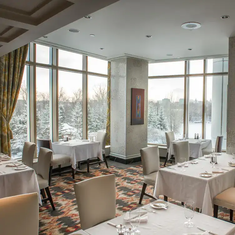 A bright restaurant room overlooking a snowy landscape from Arôme, one of the best brunch places in Ottawa.