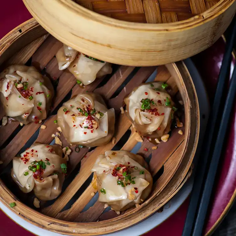 Steamed dumplings in a bamboo steamer from Belmont, one of the best brunch spots in Ottawa.