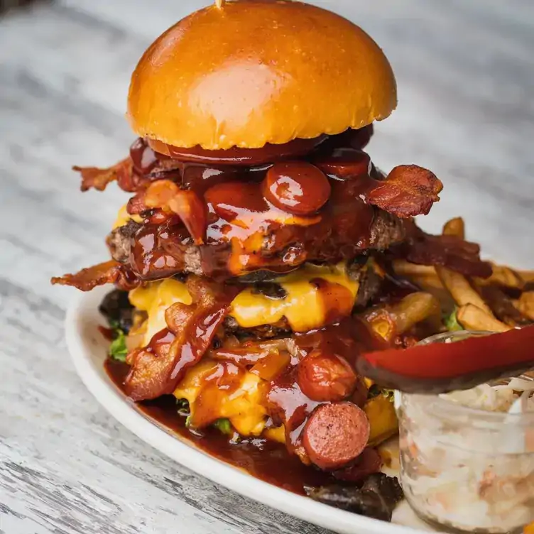 A tall burger at La Belle et La Boeuf in Montreal