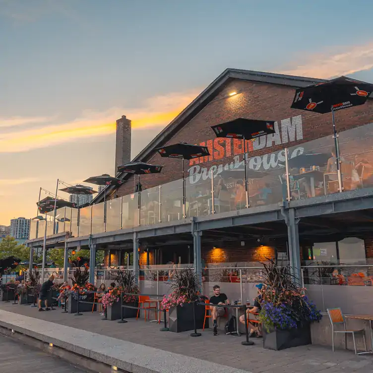 Choose a seat on one of four expansive patios overlooking Lake Ontario. Credit: Amsterdam Brewhouse & Restaurant