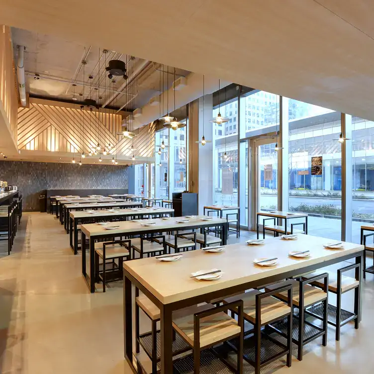 The sunny and sleek dining room at KINKA IZAKAYA HARBOURFRONT, one of the best Harbourfront restaurants in Toronto.