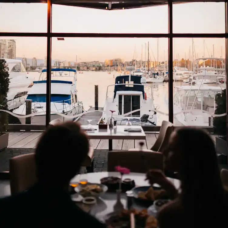 A view of the boats in the harbour dock in front of Dockside Restaurant, one of the best view restaurants on Vancouver’s Granville Island.