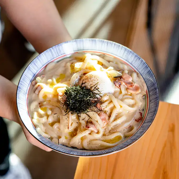 Udon noodles with bacon at KINKA IZAKAYA HARBOURFRONT, one of the best Harbourfront restaurants Toronto offers.