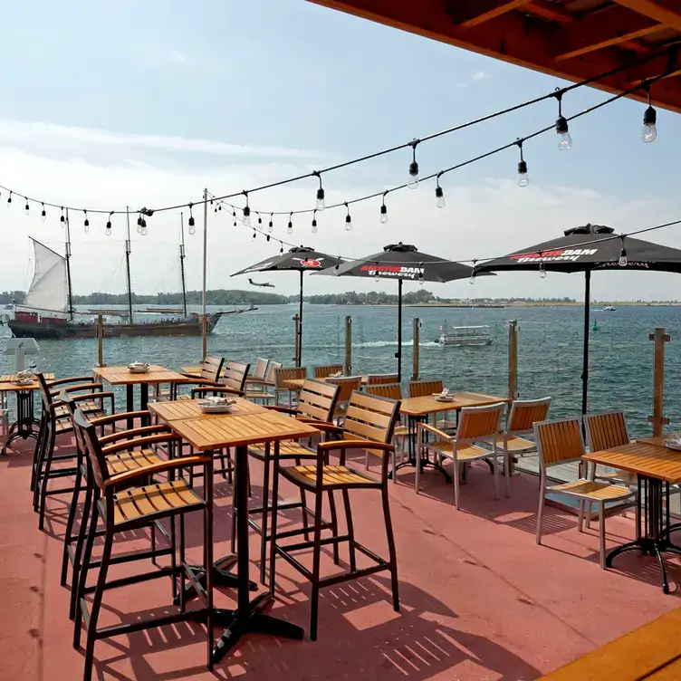 A patio directly over the waters of Lake Ontario at Amsterdam Brewhouse & Restaurant, one of the best restaurants on the Toronto Harbour.