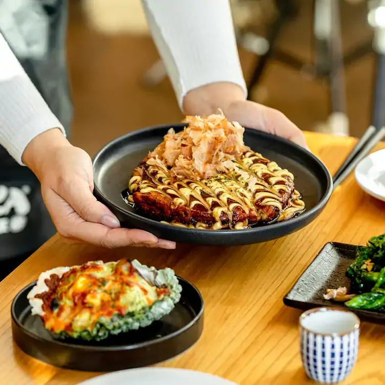 A selection of Japanese izakaya dishes at KINKA IZAKAYA HARBOURFRONT, one of the best Harbourfront restaurants in Toronto.