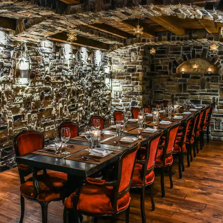 A cosy private dining room with traditional Italian decor at La Vecchia, one of the top restaurants for private dining in Toronto.