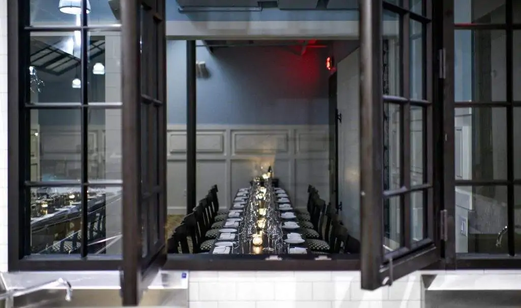 A restaurant setting with a long table